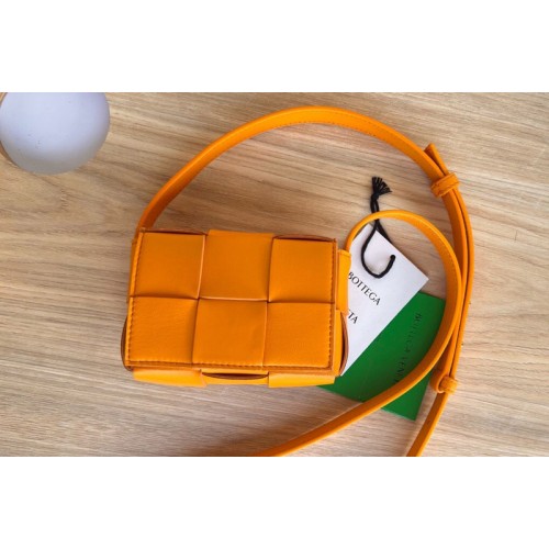 Bottega Veneta Cassette mini bag in Orange Intreccio leather